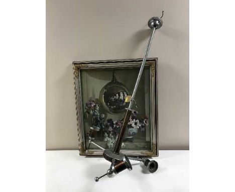 A railway light fitting with glass shades and a framed print 