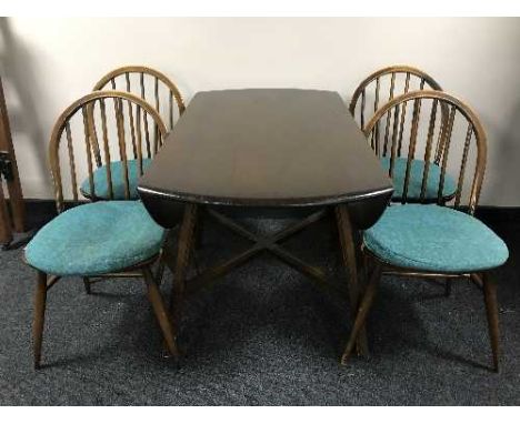 An Ercol elm drop leaf table and four chairs 