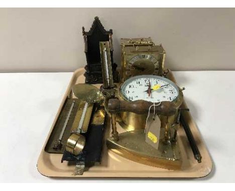 A tray of small brass propeller, brass ship's style clock, mantel clock, thermometers, etc 