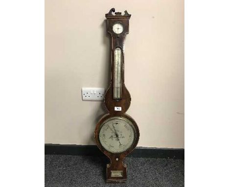 A Victorian inlaid banjo barometer with silvered dial