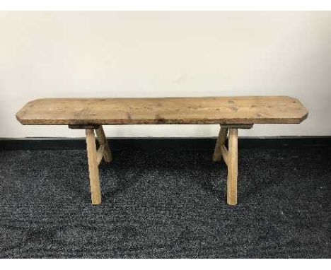 A rustic pine bench 
