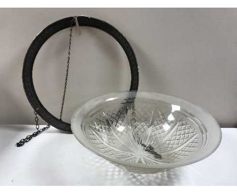 A circular glass hanging light fitting in a metal frame 