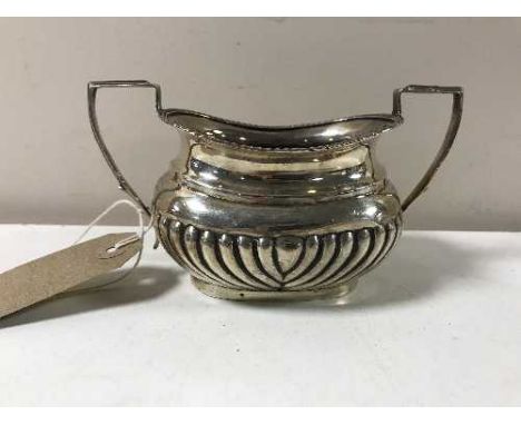 A silver twin handled sugar basin