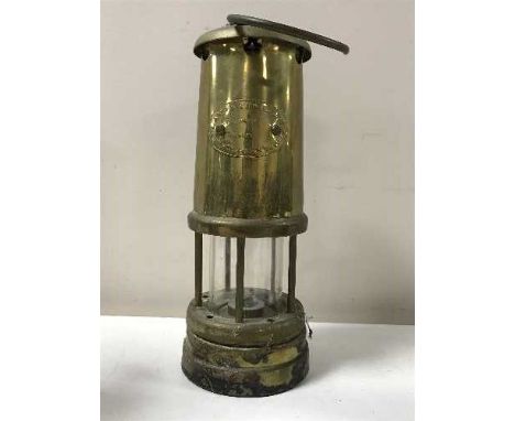 A brass Lamp Limelight miner's lamp together with two miniature Horden Mechanics Lodge Durham miner's lamps