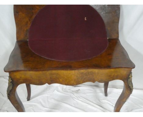 An ornate 19th century French inlaid walnut turn-over top card table with baize lined playing surface, floral inlaid top on s
