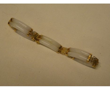 A Chinese 14ct gold mounted jade bracelet