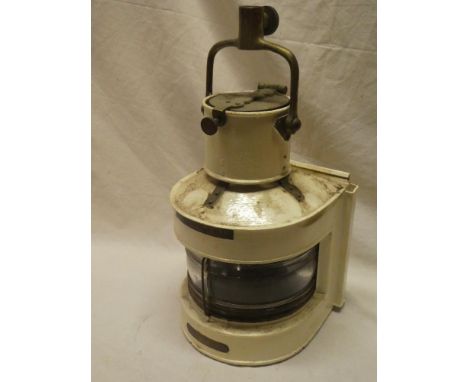 A brass mounted and painted metal ship's mast head lamp, Patt. 25A by the Birmingham Engineering Co. Ltd with original oil fi