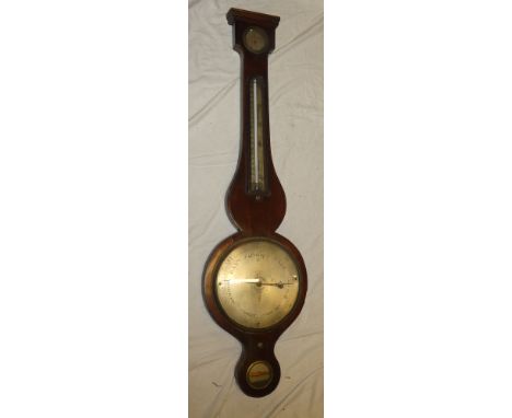 A 19th century mercury barometer by G. Copeni with silvered circular dial below thermometer in polished mahogany case