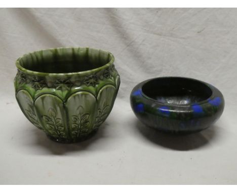An Ault pottery circular jardiniere with raised leaf decoration on green ground and a Minton's "Astra ware" pottery circular 