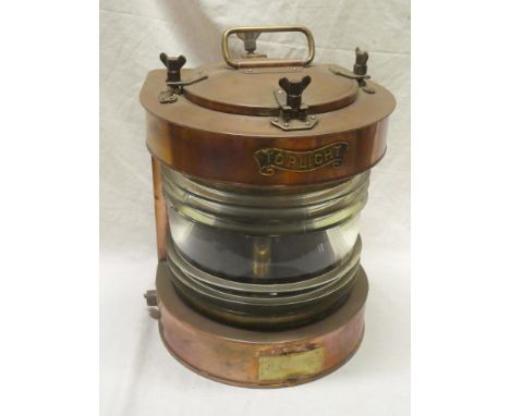 A brass mounted copper ship's lamp marked "Toplight" with electric fitment, 15" high overall