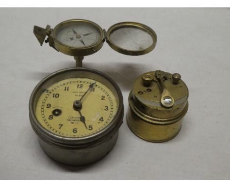 A brass circular plotting clock by Colborne of Trowbridge; small brass pocket sextant and a brass pedestal compass by Stanley