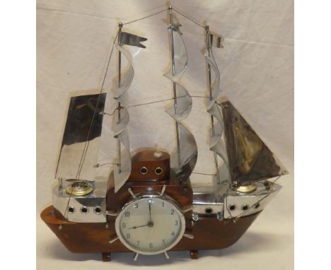 An unusual Art Deco polished wood and chromium-plated mantel clock/lamp in the form of a three-masted sailing ship 17" long