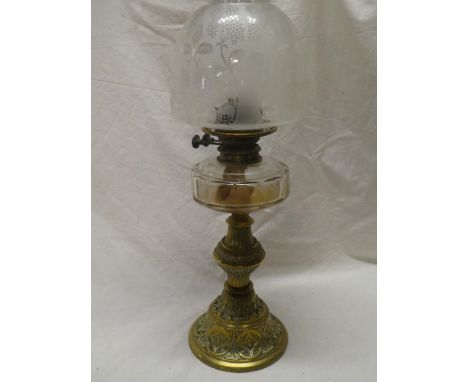 A Victorian brass oil lamp by Hinks &amp; Sons with ornate tapered base, clear glass reservoir and etched glass shade