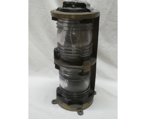 A nautical twin-section lamp with electric fitment and ribbed glass lenses 16½" high