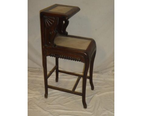 A Chinese carved rosewood two-tier side table with inset marble tops on scroll-shaped legs