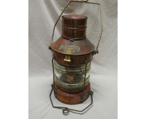 A brass mounted copper ship's "Not Under Command" lantern with ribbed glass lens (af) and oil lamp fitment 24" high overall