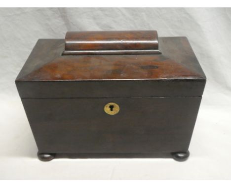 A Victorian rosewood sarcophagus-shaped tea caddy with internal brass mixing bowl and compartment