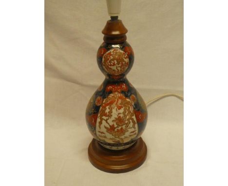 A Japanese Imari pottery double gourd-shaped vase, adapted as a table lamp with painted decoration