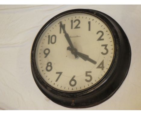 A 1920's/30's Genalex wall clock with circular dial in painted metal circular case 24" diameter