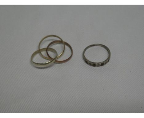 A 9ct gold three part wedding band in three colours and an eternity-style dress ring set sapphires and diamonds (2)