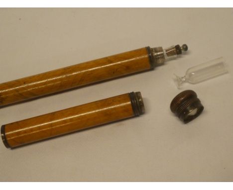 A Tippler's stick with internal glass flask, the top with internal glass pedestal goblet in Malucca casing with electroplated