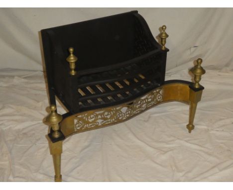 A good quality Georgian-style brass mounted iron fire grate with brass pierced apron and finials, 29" wide overall