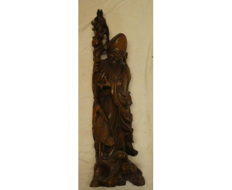 A large Japanese carved wood figure of an elderly bearded male holding a staff, adapted as a table lamp, 34" high overall