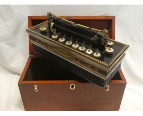 An old rectangular chromatic accordion by J. Gregory of Nottingham in  fitted wooden case
