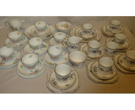 A Shelley china part tea set with floral decoration comprising 7 tea cups, 7 saucers, 7 tea plates, cake plate, milk jug and 