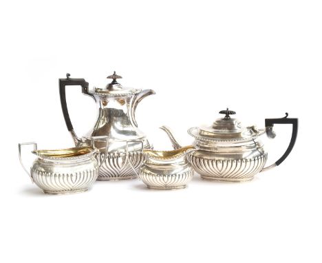 A three piece tea set by Fordham &amp; Faulkner, Sheffield 1915 and Elkington &amp; Co Ltd, Birmingham 1914, half gadrooned, 