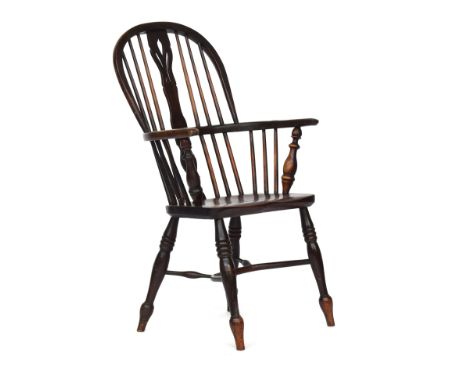 A splat back Windsor chair, probably Lincolnshire, narrow fleur de lys pierced splat, turned front arm supports, the elm sadd