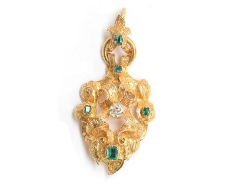 A mid Victorian gold pendant, tests as 14ct or higher, of scrolling open form engraved with intricate foliate detail, set wit
