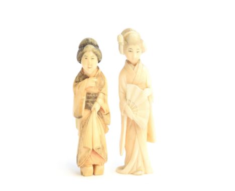 A Japanese Meiji era netsuke in the form of a geisha, 9cm high; together with a similar okimono, 8.5cm high (2) 