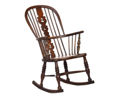 A Windsor rocking chair, probably Lincolnshire, first half 19th century, with shaped pierced splat, the arm bow on turned fro