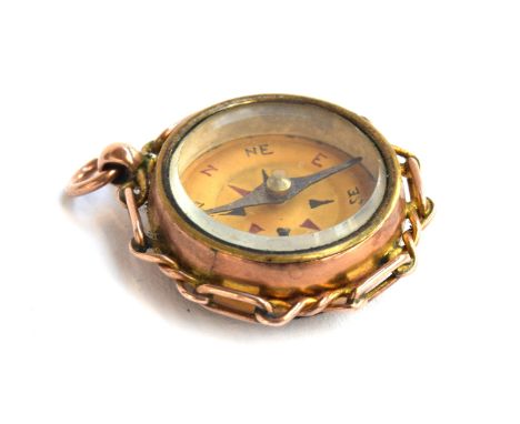 A 9ct gold compass fob, the reverse set with carnelian, hallmarked Birmingham, 1901, approx. 10.3g, 2.6cm diameter 