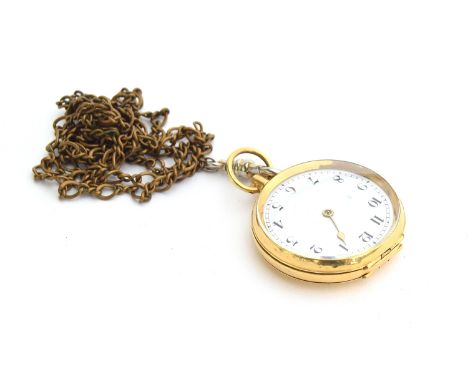 A small 18ct gold open face fob watch, Arabic numerals to white enamel dial, on a yellow metal chain 