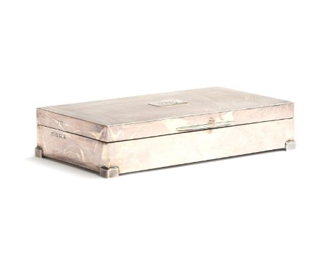 An engine turned silver cigarette box by Deakin &amp; Francis Ltd, Birmingham 1938, the top monogrammed JC, 16.5cm wide 