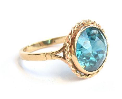 A 9ct gold and blue topaz ring, size Q 1/2, approx. 4.9g 