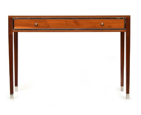 A contemporary designer console table, with single frieze drawer, on square tapered legs with chromed cappings, 110cm wide, 4