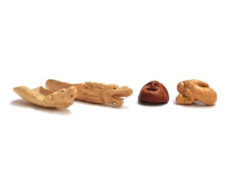 A collection of Japanese netsukes to include two boxwood tea scoops, one in the form of a dragon, signed, 13cm long, the othe