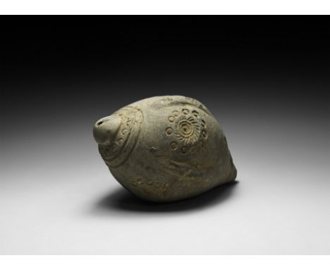 9th-11th century AD. A piriform ceramic vessel with domed rim, bands at the shoulder and medial circumferential tracks and fl