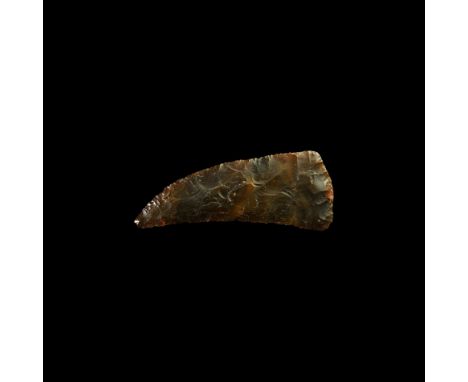 Neolithic, 6th-3rd millennium BC. A finely knapped bifacial flint halberd sickle or knife, with gently curved triangular two-