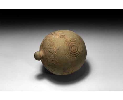 9th-11th century AD. A spherical ceramic vessel with short neck, domed lip and pointed base, band of impressed geometric orna