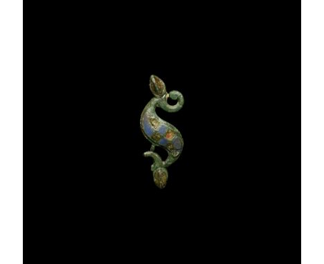 1st-2nd century AD. An S-shaped brooch with scaphoid terminals formed as head and tail of the beast, decorated body comprisin
