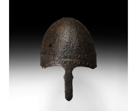 6th-7th century AD. A segmented iron helmet formed from overlapping and rivetted sheets, two upper bands forming a cross runn