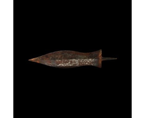 2nd-3rd century AD. An iron dagger blade (pugio), with a flat tang, the blade squat and waisted, shallow midrib with side cha