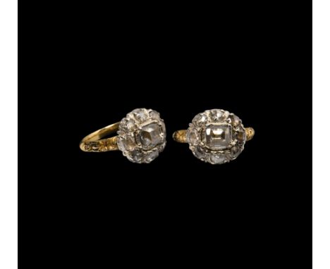 c.1870 AD. A gold ring with plain band and ornamental shoulders showing traces of enamel tapering to the oval silver bezel se