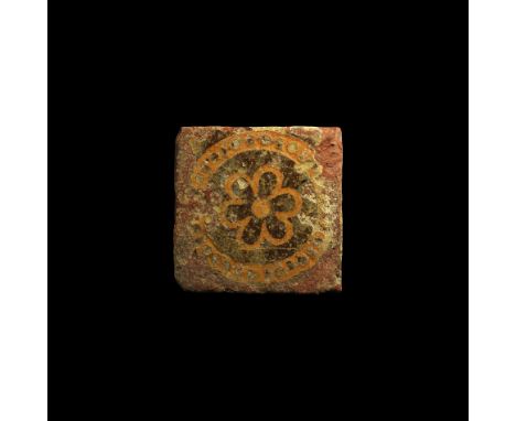 15th-16th century AD. A rectangular glazed ceramic floor tile with low-relief hexafoil motif within a segmented annular borde