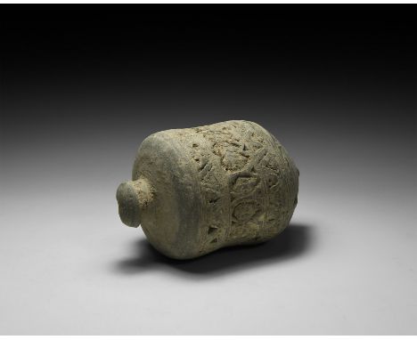 9th-11th century AD. A carinated ceramic vessel with broad shoulder, short neck, domed lip and conical base, circumferential 