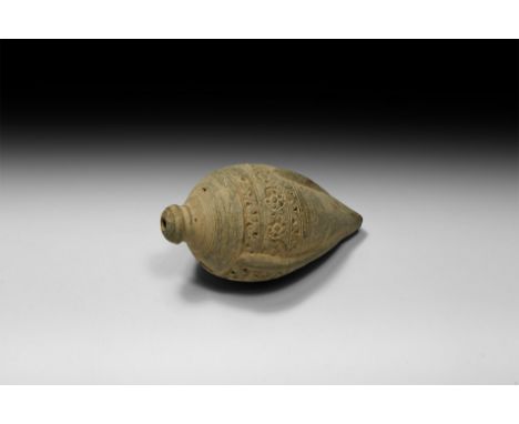 9th-11th century AD. A piriform ceramic vessel with short neck, domed lip and conical base, bands of impressed geometric orna